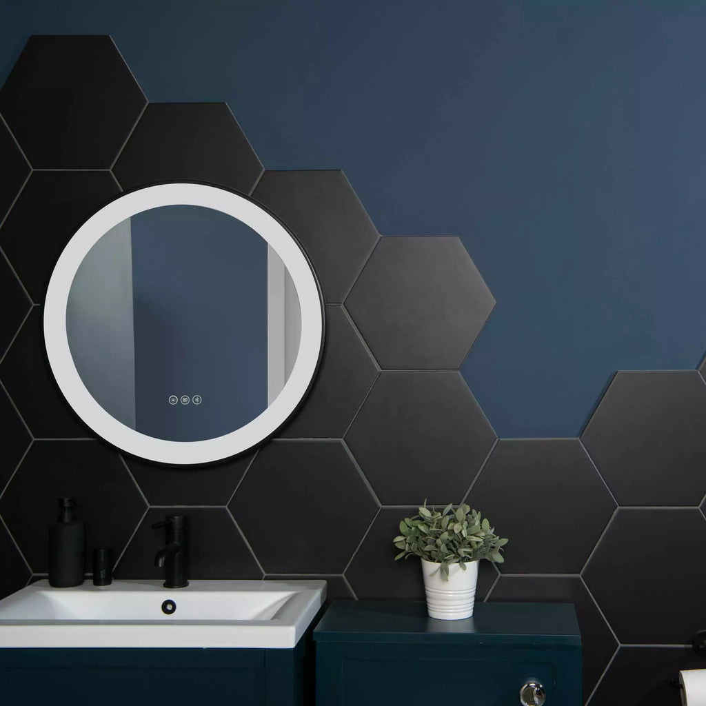 Amsterdam Hexagon Matt Black Porcelain Wall and Floor Tile on Bathroom Wall, Half Wall is Tiled with the hexagon, the other half is painted navy blue. There Sink Unit and bathroom cuboard is also navy blue