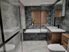 Ark Slate Cloud Grey Stone Effect 30x60cm Porcelain Wall and Floor Tile in Bathroom, paired with darker tiles