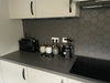 Avatar Matt Deep Black Hexagon Porcelain Wall and Floor Tile in Kitchen, used as a splashback image 3
