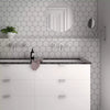 Avatar Matt White Hexagon Porcelain Wall and Floor Tile on Bathroom Wall behind bathroom sink as a feature wall