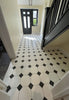 Black and White Traditional Diamond Pattern Ceramic Wall and Floor Tile on Hallway Floor