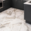 Kitchen with dark cabinets and a marble-patterned floor.