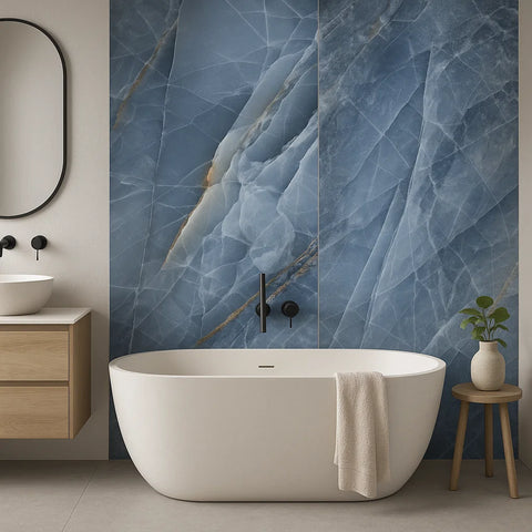 Modern bathroom with a freestanding bathtub, blue marble wall, and wooden cabinet.