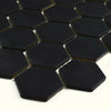 Hexagonal black mosaic tiles on a white background