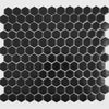 Hexagonal black tiles arranged in a mosaic pattern