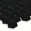 Hexagonal black matt mosaic tiles on a white background
