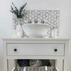 Meteorite Hexagon Authentic White and Grey Marble Mosaic Wall and Floor Tile behind bathroom sink