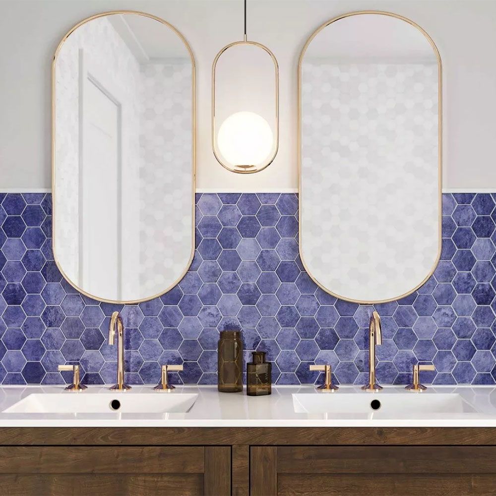 Portofino Blue Hexagon Polished Porcelain 510x265mm Wall Tile in Bathroom with Double Couples Sink, and Gold Feautres