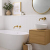 Soft White Artisan Herringbone Porcelain Matt Mosaic Wall and Floor Tile in Bathroom with Gold Accents