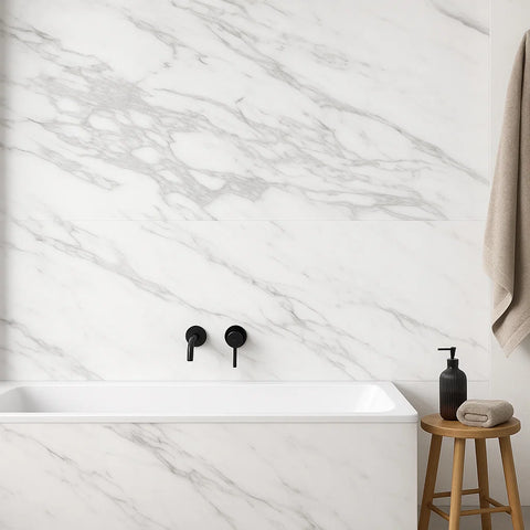 Bathroom with marble wall tiles, white bathtub, black fixtures, and wooden stool with towel and soap.