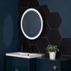 Amsterdam Hexagon Matt Black Porcelain Wall and Floor Tile on Bathroom Wall, Half of the Wall is Tiled with the hexagon, the other half is painted navy blue. There Sink Unit and bathroom cupboard is also navy blue
