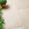 Modern garden patio featuring Egyptian Sand 600x600mm outdoor porcelain paving slabs with natural sandstone effect and subtle colour variation.