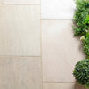 Contemporary patio designed with Egyptian Sand porcelain paving slabs, featuring authentic sandstone shading, R11 slip resistance and low-maintenance durability.