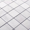 White square mosaic tiles with a subtle light gray marble or stone texture, arranged in a diagonal grid pattern with thin dark grout lines.