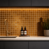 Modern kitchen with gold tiles, sink, and decorative items.