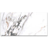 Marble-patterned surface with gray and gold veins on a white background