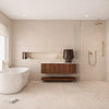 Modern bathroom with freestanding bathtub, wooden vanity, and shower area.