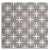 Gray tiles with white floral patterns arranged in a grid.